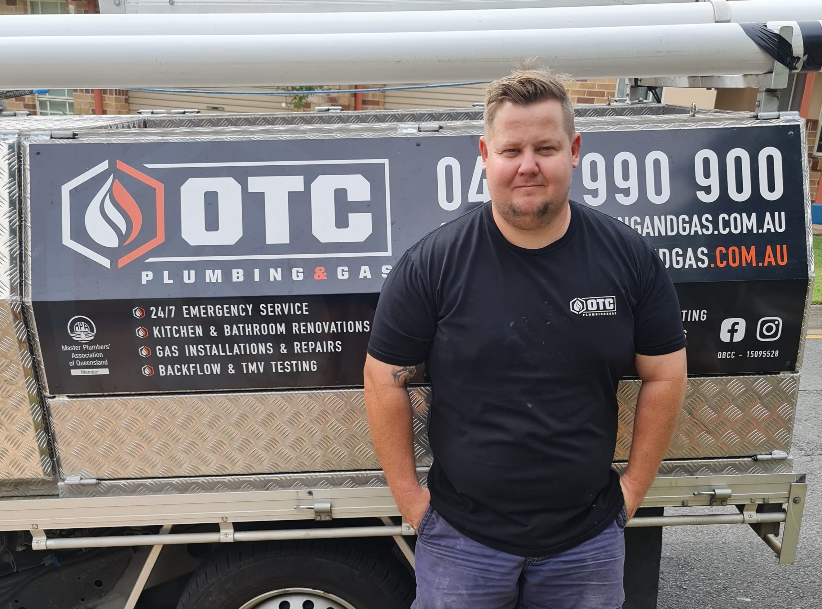 Plumber Standing Next to His Ute — OTC Plumbing & Gas Pty Ltd In Brisbane , QLD