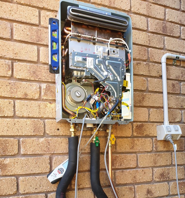 Repairing a Continuous Flow Hot Water Heater — OTC Plumbing & Gas Pty Ltd In Brisbane , QLD
